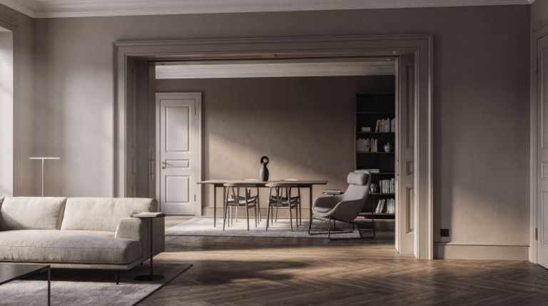 Two connected rooms are separated by a very wide rectangular cased opening with thick painted trim and clear wall returns, preserving daylight and sightlines while keeping the rooms distinct without an arch.